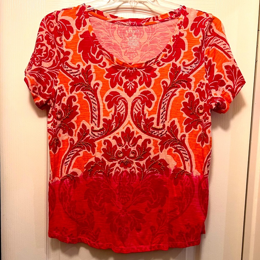 Sonoma top with beautiful bead work on the front flowing with the pattern.. Cute